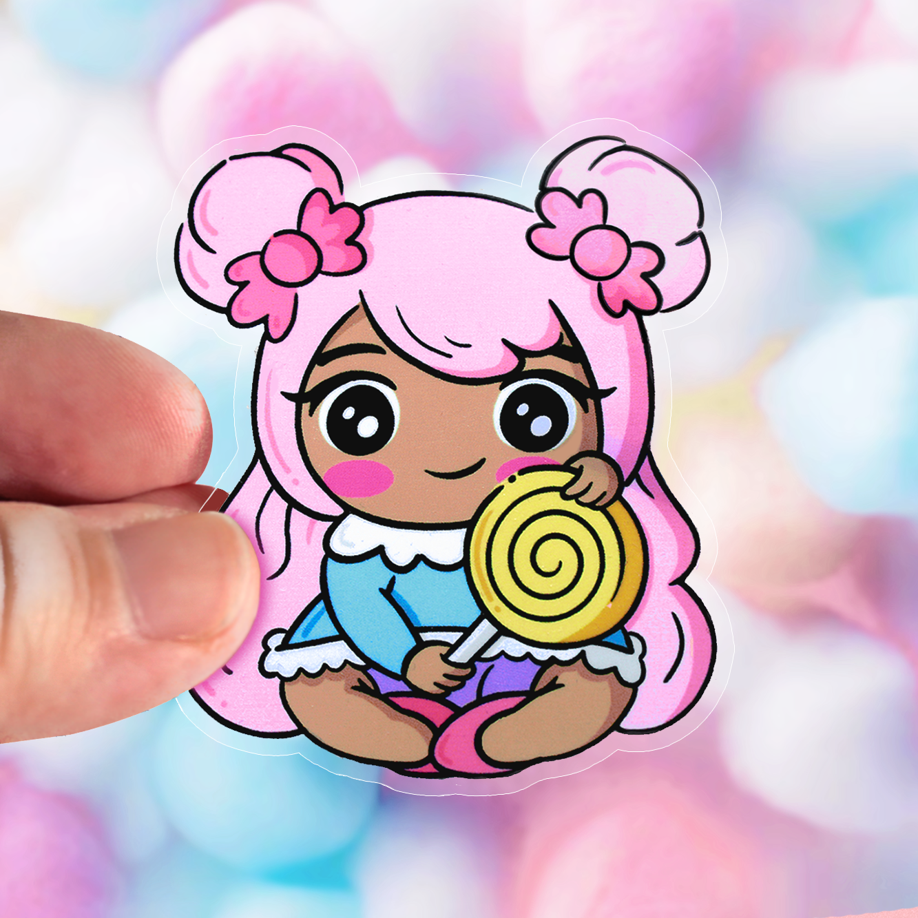 Hand drawn vinyl sticker of a kawaii girl with pink hair holding a lollypop