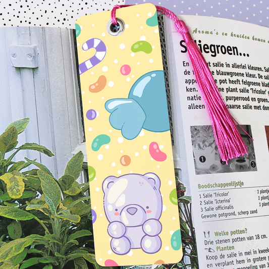 Hand made semi glossy cardboard bookmark with metal eyelet and tassel with hand drawn candy
