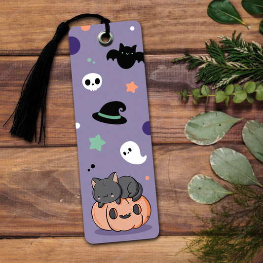 Hand made semi glossy cardboard bookmark with metal eyelet and tassel with hand drawn halloween characters