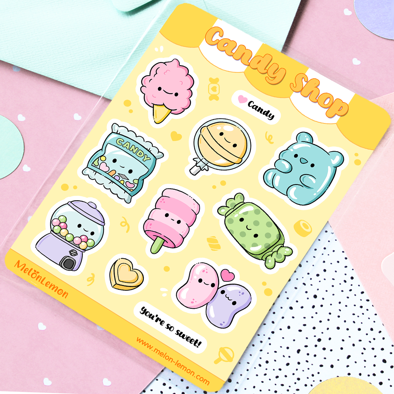 Hand drawn stickers sheet with kawaii candy and sweets on a yellow background.