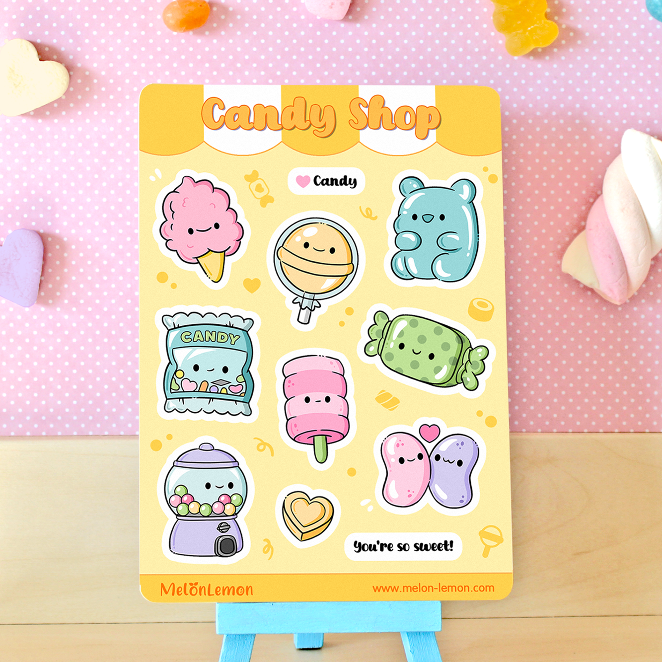 Hand drawn stickers sheet with kawaii candy and sweets on a yellow background.