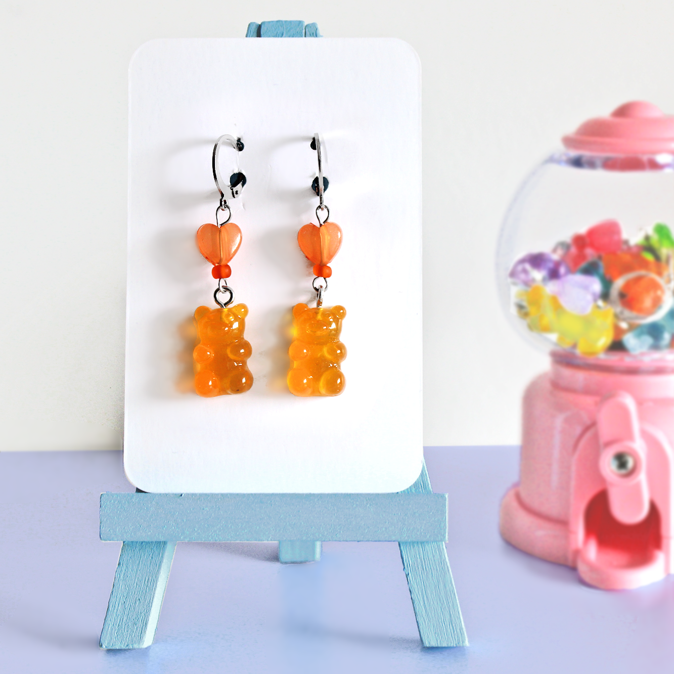 Pair of hand made stainless steel earrings with colored resin gummy bears