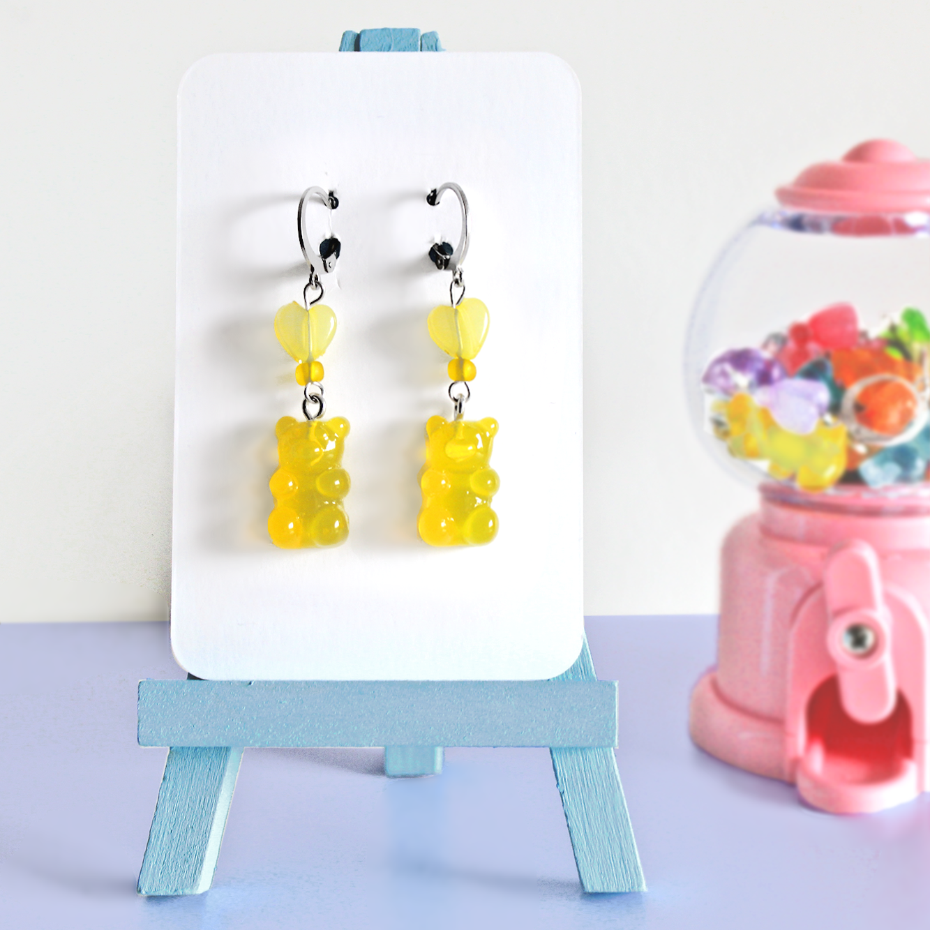 Pair of hand made stainless steel earrings with colored resin gummy bears
