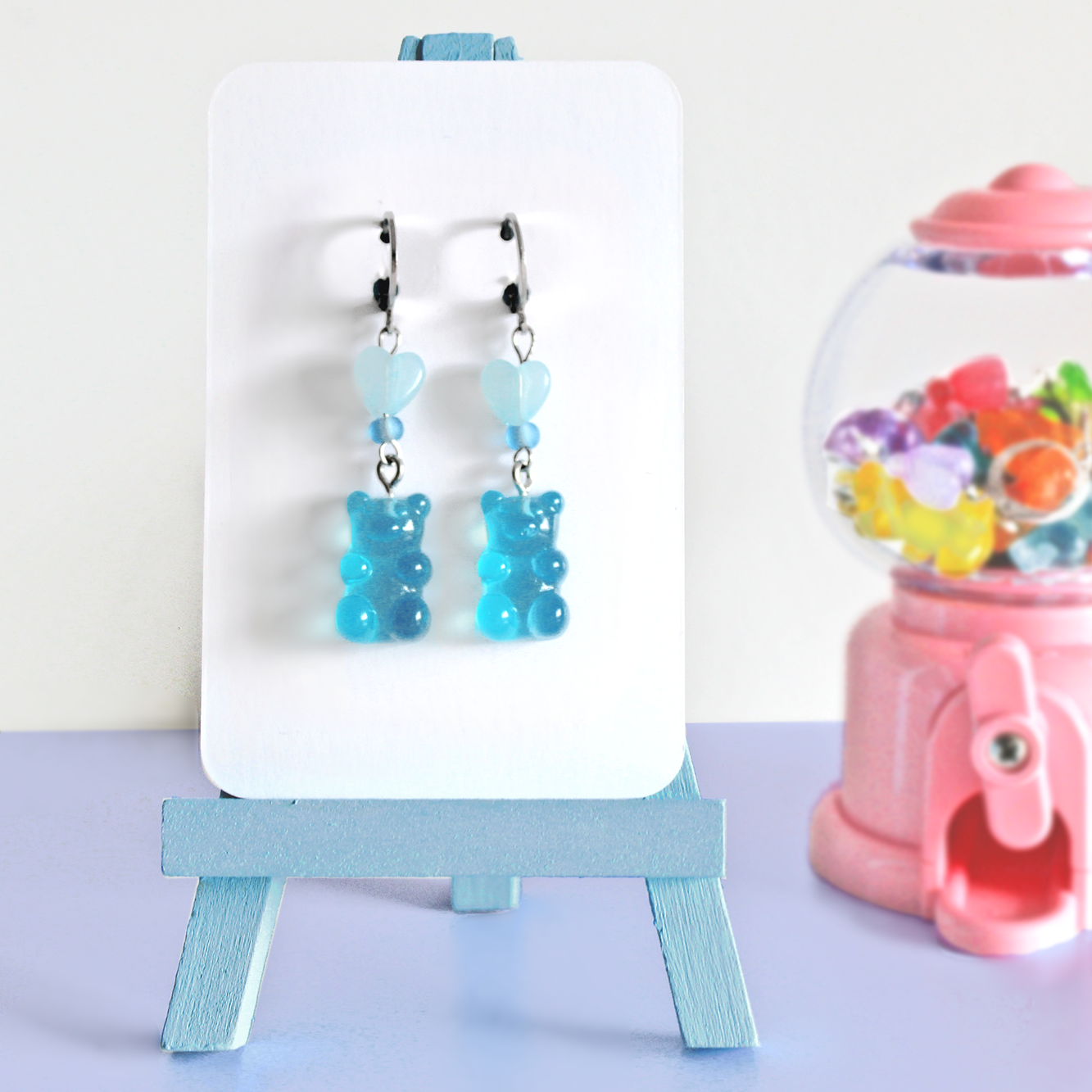 Pair of hand made stainless steel earrings with colored resin gummy bears