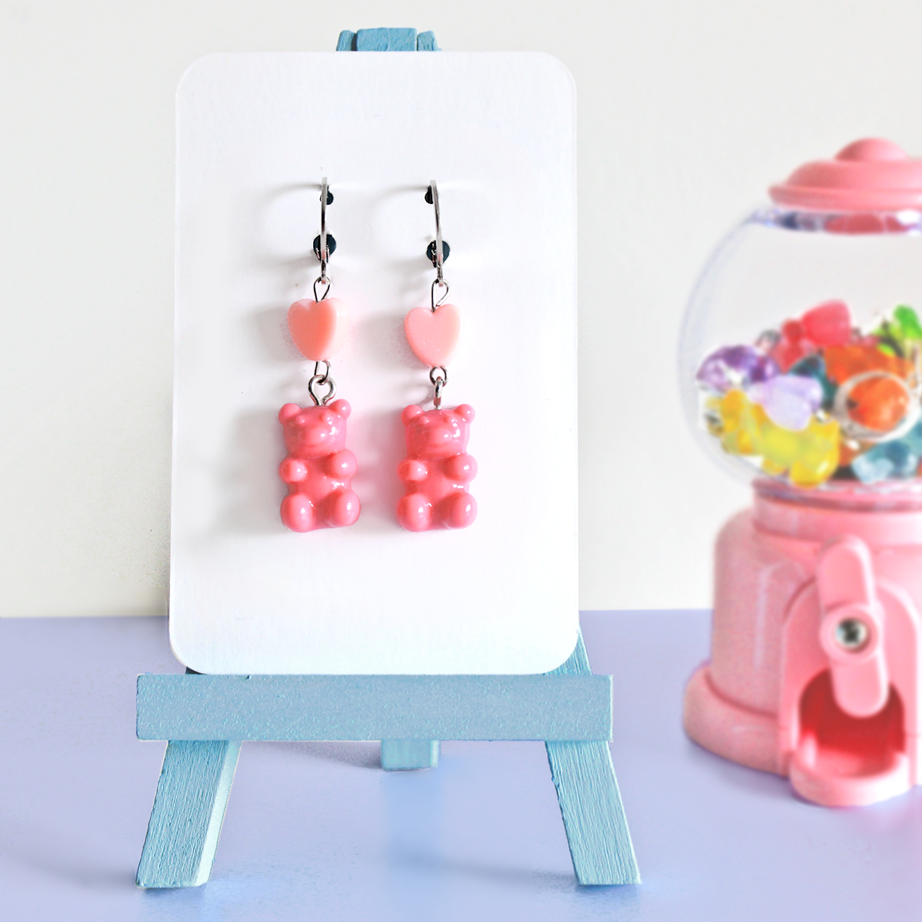 Pair of hand made stainless steel earrings with colored resin gummy bears