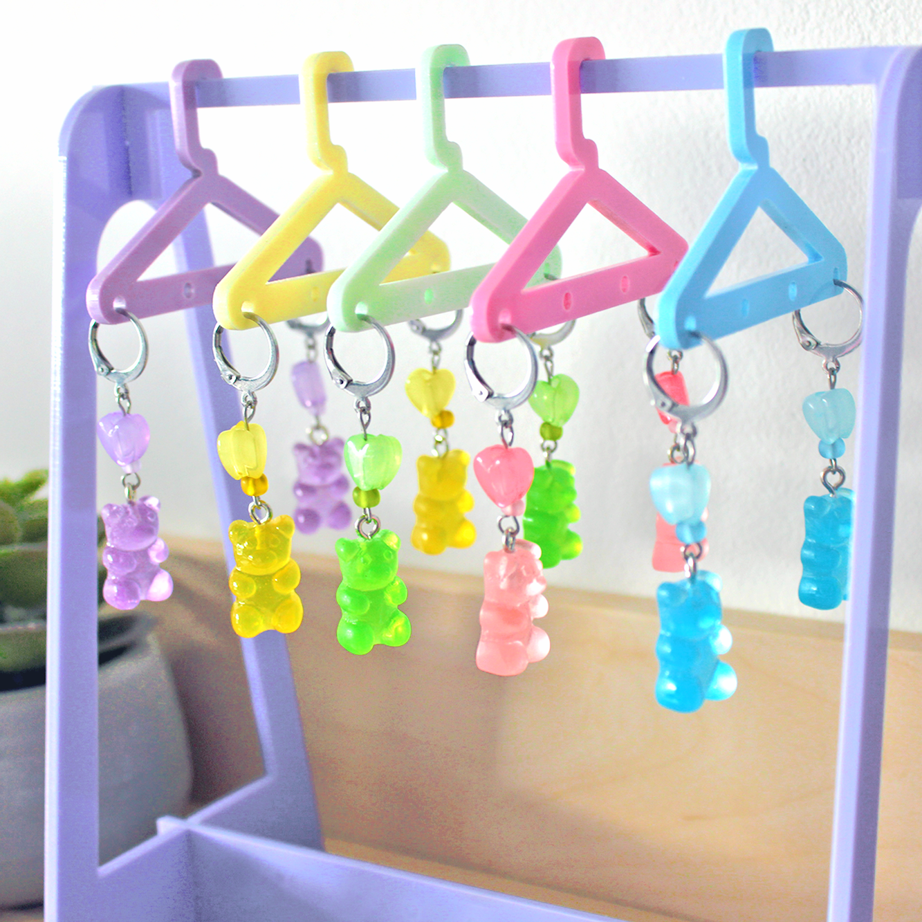 Pair of hand made stainless steel earrings with colored resin gummy bears